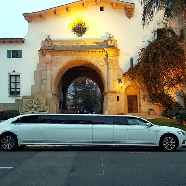 Lincoln Continental stretch limousine beneath an arch