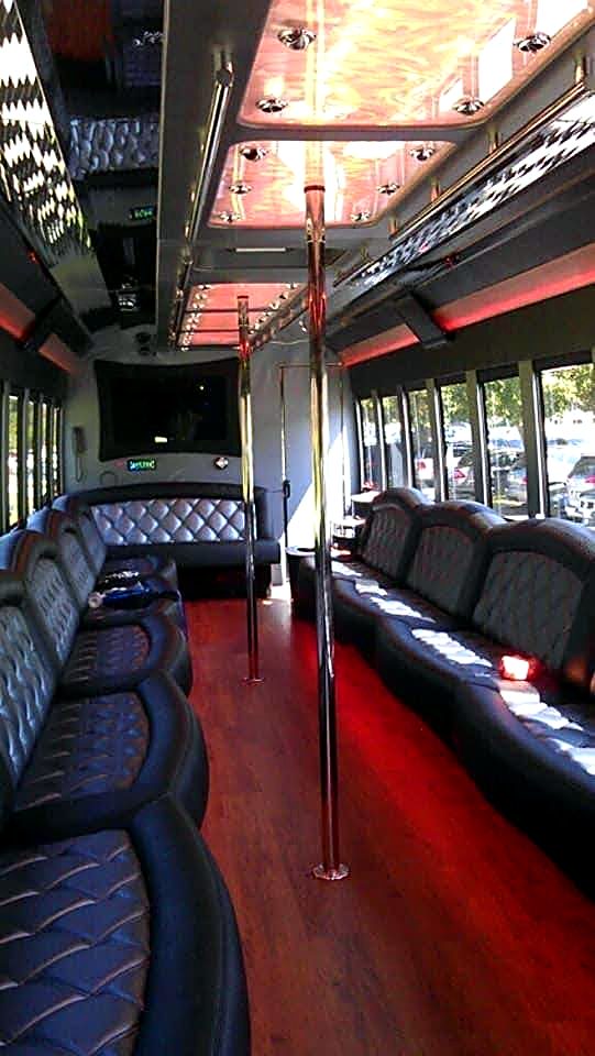 Party bus interior with dance pole and LED lighting